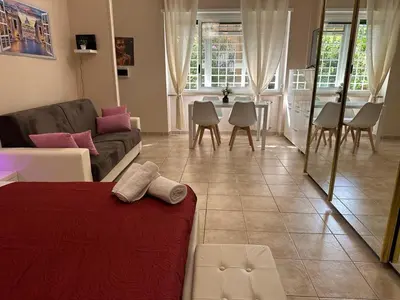 a living room with a couch and a table at Rome Maya Home in Rome
