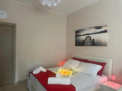 a bedroom with a bed with a candle on it at Rome Maya Home in Rome