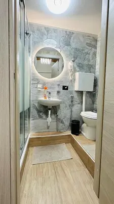 a bathroom with a sink and a toilet and a mirror at Soha's Holiday in Rome