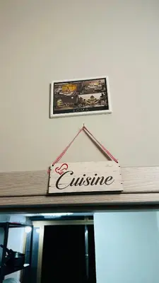 a sign on top of a counter with a picture at Soha's Holiday in Rome