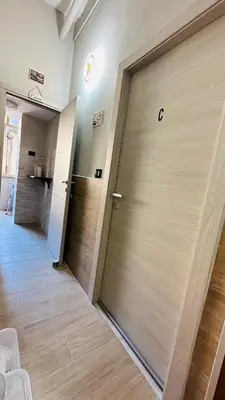 a pair of doors in a room with wood at Soha's Holiday in Rome