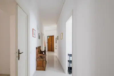a hallway with white walls and white floors at Luminoso vicino Piazzale Flaminio e Roma centro in Rome