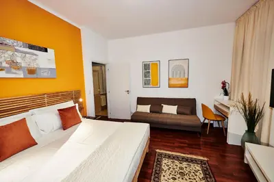 a hotel room with a bed and a couch at Vatican luxury - private parking free - meospiti luxury in Rome
