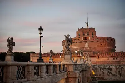 a building with statues and a street light in front of it at Vatican luxury - private parking free - meospiti luxury in Rome