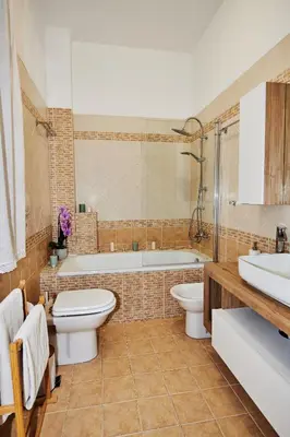 a bathroom with a tub and a toilet and a sink at Vatican luxury - private parking free - meospiti luxury in Rome