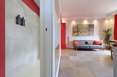 a living room with a couch and a table at suity I monkeys apartment in Rome
