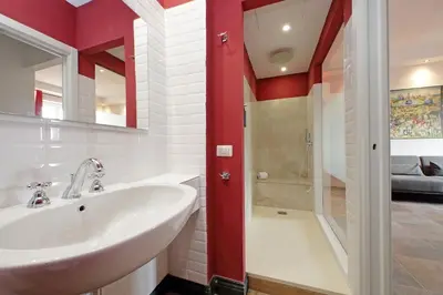 a bathroom with a sink and a shower at suity I monkeys apartment in Rome
