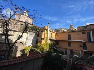 a group of buildings in a city at Over the Roman ruins in Rome