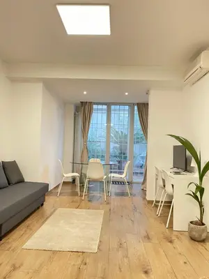 a living room with a couch and a table at Green Home in Rome