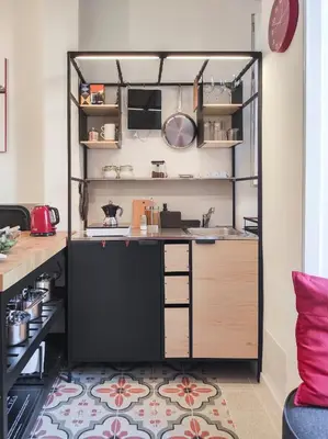 a small kitchen with a counter and shelves at Cortile al Vaticano by Bed&Bros in Rome