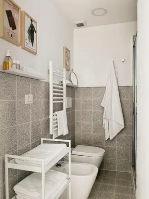 a bathroom with a toilet and a sink at Cortile al Vaticano by Bed&Bros in Rome