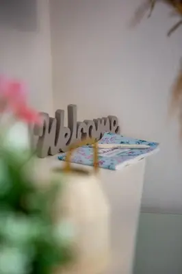 a white bucket with a sign that reads happy birthday at Holiday Homes Rome - Portuense 21 - Studio with little private Garden in Rome