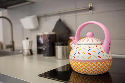 a polka dot tea kettle sitting on a kitchen counter at Holiday Homes Rome - Portuense 21 - Studio with little private Garden in Rome