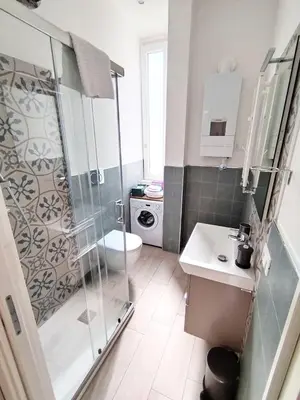 a bathroom with a shower and a toilet and a sink at Il Cortile - Appartamento nel cuore di Testaccio in Rome