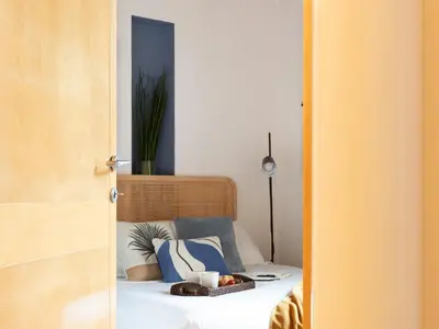 a bedroom with a bed with a bowl of fruit on it at The Best Rent - Two-bedroom apartment with terrace near Trevi Fountain in Rome