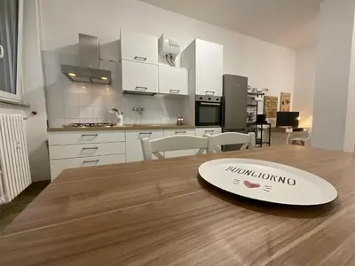 a surfboard sitting on a wooden table in a kitchen at Casa Sofia Trastevere in Rome