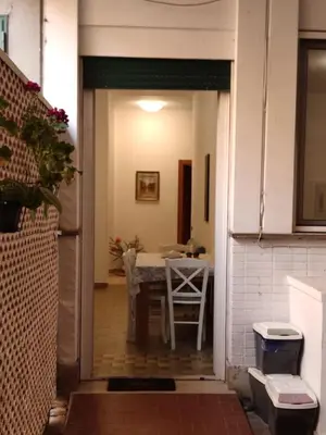 an open door to a dining room with a table at Casa Sofia Trastevere in Rome