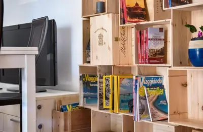 a pile of boxes sitting on top of a desk at Appartamento con giardino via silvestri in Rome