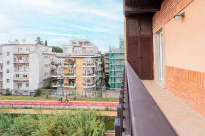 a balcony of a building with a view of buildings at 15 Minuti a Piedi dai Musei Vaticani in Rome