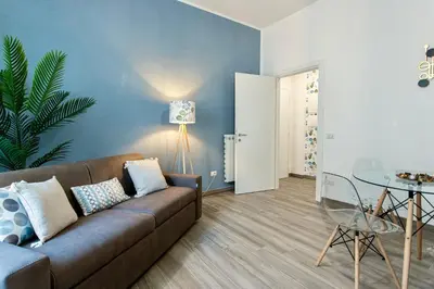 a living room with a couch and a table at Etta Suite - Close Vatican Museum in Rome