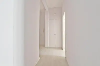 an empty room with white walls and a hallway at Martina Garden in Rome