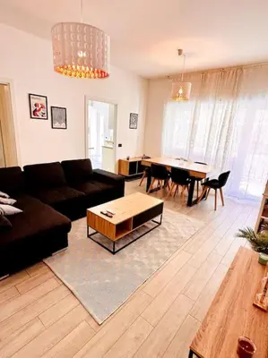 a living room with a couch and a table at Baldo Family Apartment - Rome Collection in Rome