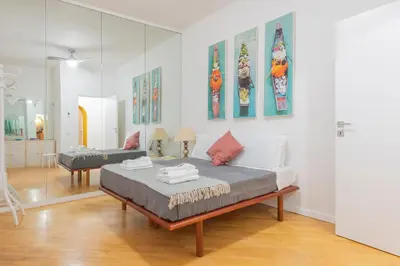 a bedroom with a bed and a mirror at Colosseum Flat - ZEN23 in Rome