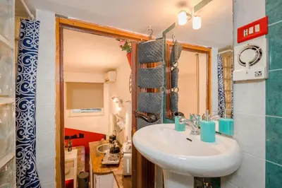 a bathroom with a sink and a mirror at Dimora Pastini in Rome