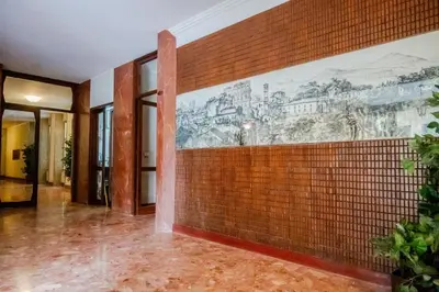 a room with a mural on the wall at Fleming in Rome