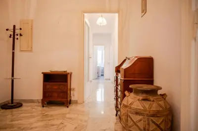 a room with a table and a vase in it at Fleming in Rome