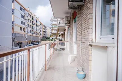 an empty balcony of a building with a blue pot at Fleming in Rome