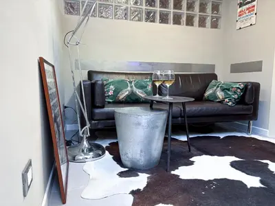 a living room with a couch and a table at The shelter in Rome