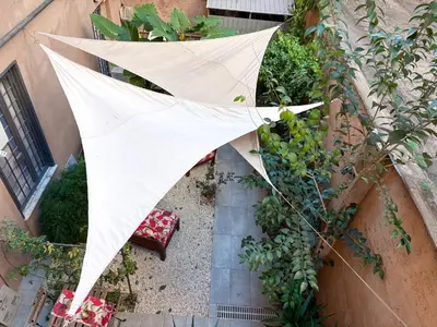 an overhead view of an umbrella in a garden at The shelter in Rome