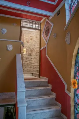 a set of stairs in a building with a door at Domus Augustea - 2 Floor in Rome