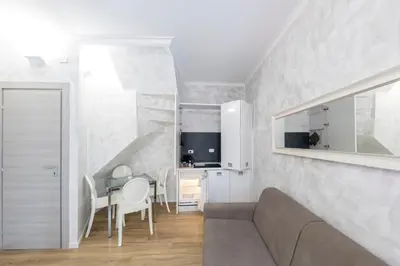 a living room with a couch and a table at Domus Augustea - 2 Floor in Rome
