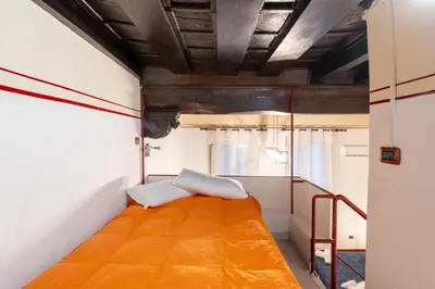 a small room with a bed in it at Sweet Rhome Navona Loft Centro Storico in Rome