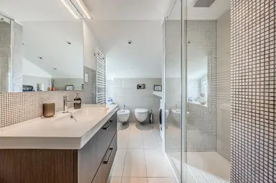 a bathroom with two sinks and a glass shower at Casa Doni Roma in Rome