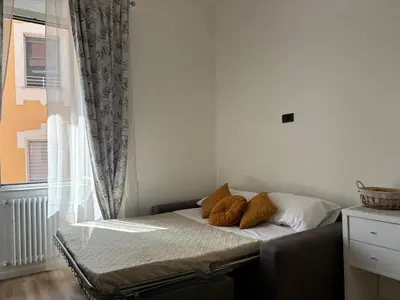 a bed with two pillows on it in a room at House of Wonders in Rome
