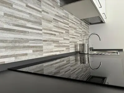a bathroom with a stone wall and a sink at House of Wonders in Rome