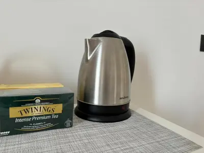 a coffee maker sitting next to a box at House of Wonders in Rome