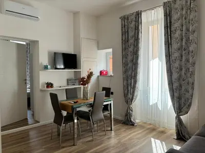 a dining room with a table and chairs at House of Wonders in Rome