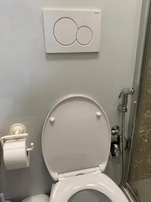 a bathroom with a toilet with a sign above it at sweety rome in Rome