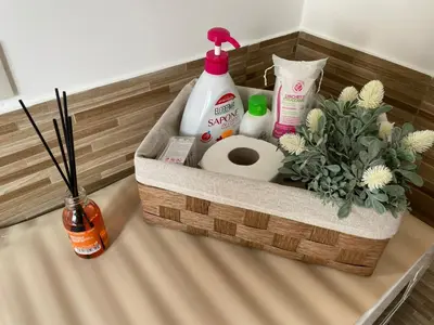 a basket with detergent and toiletries on a table at Comfort a 7 fermate dal Colosseo in Rome