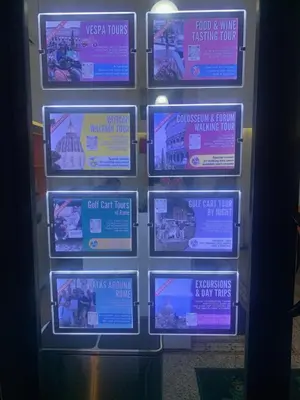 a bunch of televisions on a wall at Vatican City Green Apartment in Rome