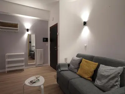 a living room with a couch and a table at Vatican City Green Apartment in Rome