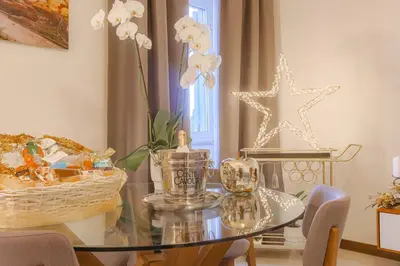 a dining room with a glass table and a star decoration at Stella Luxury House in Rome