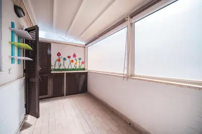 a bathroom with a large window and a tile floor at Tiber House 60 Rome Marconi - Rome Vacation M&D in Rome
