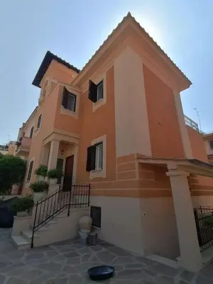 a large house with a staircase in front of it at Alessandro Luxury Home Rome in Rome
