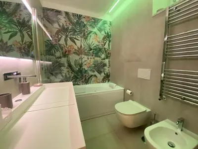 a bathroom with a sink and a toilet and a tub at Alessandro Luxury Home Rome in Rome