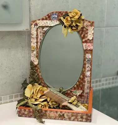 a mirror sitting on top of a counter with flowers at MySweetHome near the Vatican in Rome